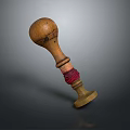 Artisan Crafted Wooden Seal With Red Wrapped String On Dark Background