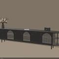 Black TV Cabinet with Arched Lattice Doors Slim Legs and Vase Radio Book on Top