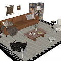 Brown Leather Sofa With Throw Pillows Blanket And Coffee Table Set On Area Rug