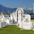 Romantic Garden Landscape With Green Lawn White Decorative Arch Floral Decor Lake View And Mountain Backdrop