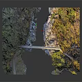 Stone Bridge Spanning River Amid Green Mountains And Yellow Trees Natural Landscape