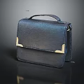 Black Leather Handbag With Gold Metal Accents Stylish Accessory For Daily Use