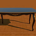 Classic Dark Wooden Desk With Blue Tabletop And Carved Leg Details