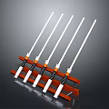 Orange Sturdy Rack With Neatly Arranged White Long Rods And Black Spiral Bases