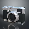 Vintage Film Camera With Silver Body Black Accents And Classic Lens Design