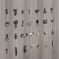 Various Metal Cabinet Handles in Different Designs Displayed on Wooden Panel