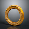 Intricately Carved Golden Ring Sculpture With Detailed Engravings And Decorative Patterns