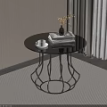 Round Glass Top Side Table with Black Metal Geometric Base Stacked Books and Vase