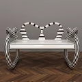 Unique Public Chair With Black And White Striped Curved Arms And White Seat