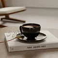 Black Coffee Cup on EAT DRINK NAP Book with Golden Spoon and White Baby's Breath