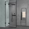 Modern Shower Head in Glass Enclosure with Tiled Wall and Towel Rack
