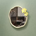 Irregular Shaped Wall Mirror With Yellow Flowers And Bedroom Reflection On Green Wall
