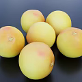 Fresh Ripe Vibrant Grapefruits with Yellow and Pink Spots on Black Surface
