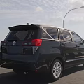 Black Toyota MPV Exterior Design On Scenic Road With Clear Sky