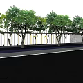 Modern Entrance Gate Design With Green Trees And Fence Along Roadside