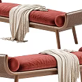 Elegant Ottoman With Red Cushion Wooden Frame Woven Details And Draped Blanket