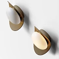 Modern Metallic Wall Lamps With Two Round Shades Illuminated On Wall