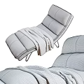 Modern White Leather Recliner with Metal Legs and Soft Knitted Blanket
