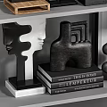 Modern Decorative Ornament Combination with Abstract Sculptures Geometric Shapes and Textured Disks on Display Shelf