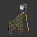 Classic Patterned Fabric Armchair With Wooden Legs Beside Yellow Tripod Floor Lamp
