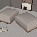 Two White Upholstered Footstools On Striped Rug With Open Book Vase And Wall Art