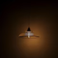 Chandelier With Transparent Glass Shade Vertical Stripes Golden Metal Top Soft Lighting Beige Wall Background