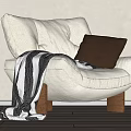 White Single Sofa Featuring Brown Leather Pillow Black And White Striped Blanket And Wooden Legs