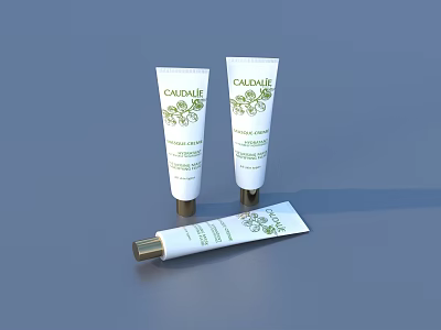 Three White Skincare Tubes With Green Floral Patterns Golden Caps And Moisturizing Formula 3d model