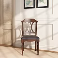 Classic Wooden Dining Chair With Carved Backrest And Leather Seat Against Light Colored Wall
