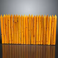 Yellow Wooden Fence With Pointed Tops And Vertical Slats On Gray Background