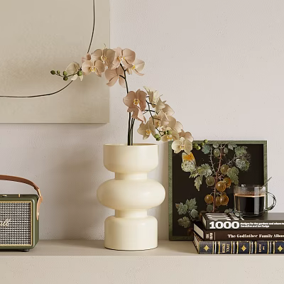 White Layered Ceramic Vase With Beige Orchids In Tabletop Decor Featuring Coffee Cup And Art 3d model
