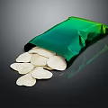 Fresh Crispy Potato Chips Spilling From Green Bag On Black Surface