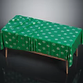 Green Tablecloth With White Clover Pattern Covering Wooden Table On Black Background