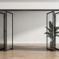 Black Open Folding Doors in Modern Room With Green Plant Wooden Floor And White Walls