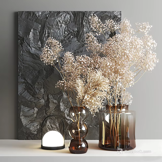 Brown Glass Vases With White Dried Flowers Against Dark Textured Wall And Small Lamp 3d model 