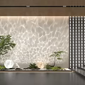 Decorative Lights Projecting Wavy Lighting Effects On Textured Wall With Green Plants And Lattice Screen