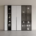 Modern Decorative Cabinet With Glass Doors And White Panels Displaying Tableware Cups Vases
