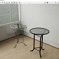 Two Modern Side Tables With Glass Tops And Silver Black Metal Frames In Room Corner