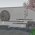 Gray Garden Wall with Circular Stone Ornament Flowing Water Green Plants and Cherry Blossom Tree