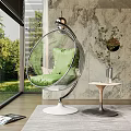 Transparent Spherical Hanging Chair With Green Cushion White Base And Marble Wall