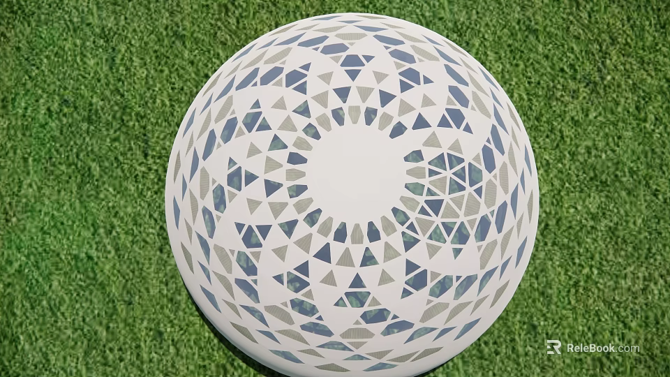 Decorative White Sphere With Blue And Gray Triangular Patterns On Green Grass 3d model 