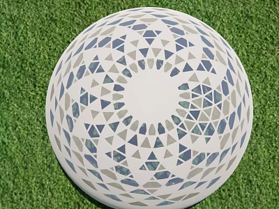 Decorative White Sphere With Blue And Gray Triangular Patterns On Green Grass 3d model