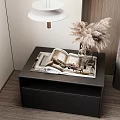 Modern Black Bedside Table With Pampas Grass Vase And Open Magazine In Bedroom