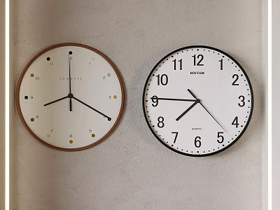 Two Stylish Wall Clocks Hanging On Beige Wall 3d model