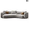 Beige Curved Sectional Sofa With Brown White Pillows And Woven Ball Decor