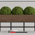Three Round Green Bonsai Plants in Wooden Planter with Black Metal Stand