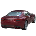 Red Maserati Coupe Sports Car With Sleek Body And Sporty Alloy Wheels