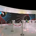 Modern Banquet Hall With White Round Bar Tables And Colorful Radial Pattern Backdrop