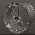 Stylish Silver Alloy Wheel Rim With Modern Spoke Design And Central Logo