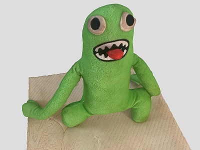 Green Plush Game Movie Character Sitting With Big Eyes Open Mouth And Teeth 3d model